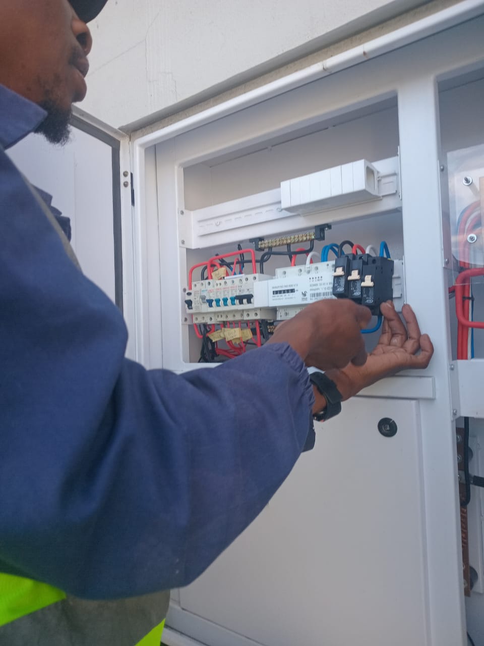 Deltar Electrical electrician working on an outdoor distribution board in Cape Town