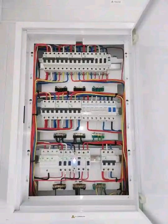 Multi row distribution board neatly wired with colour coded circuits
