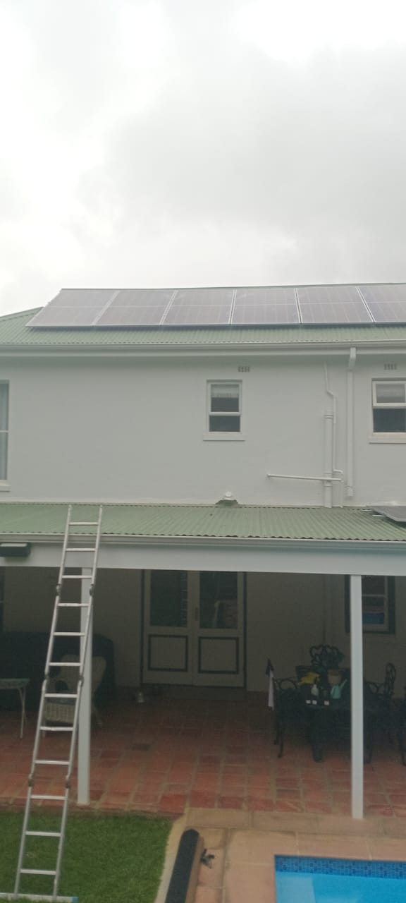 Solar panel array installed on the roof of a double storey house
